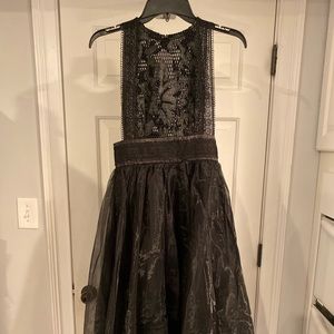 Boutique faux leather high/ low dress.